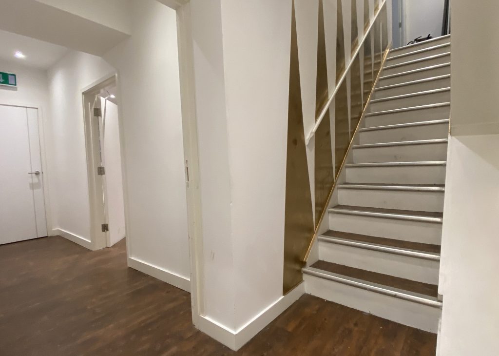 Former rear stairs with office
